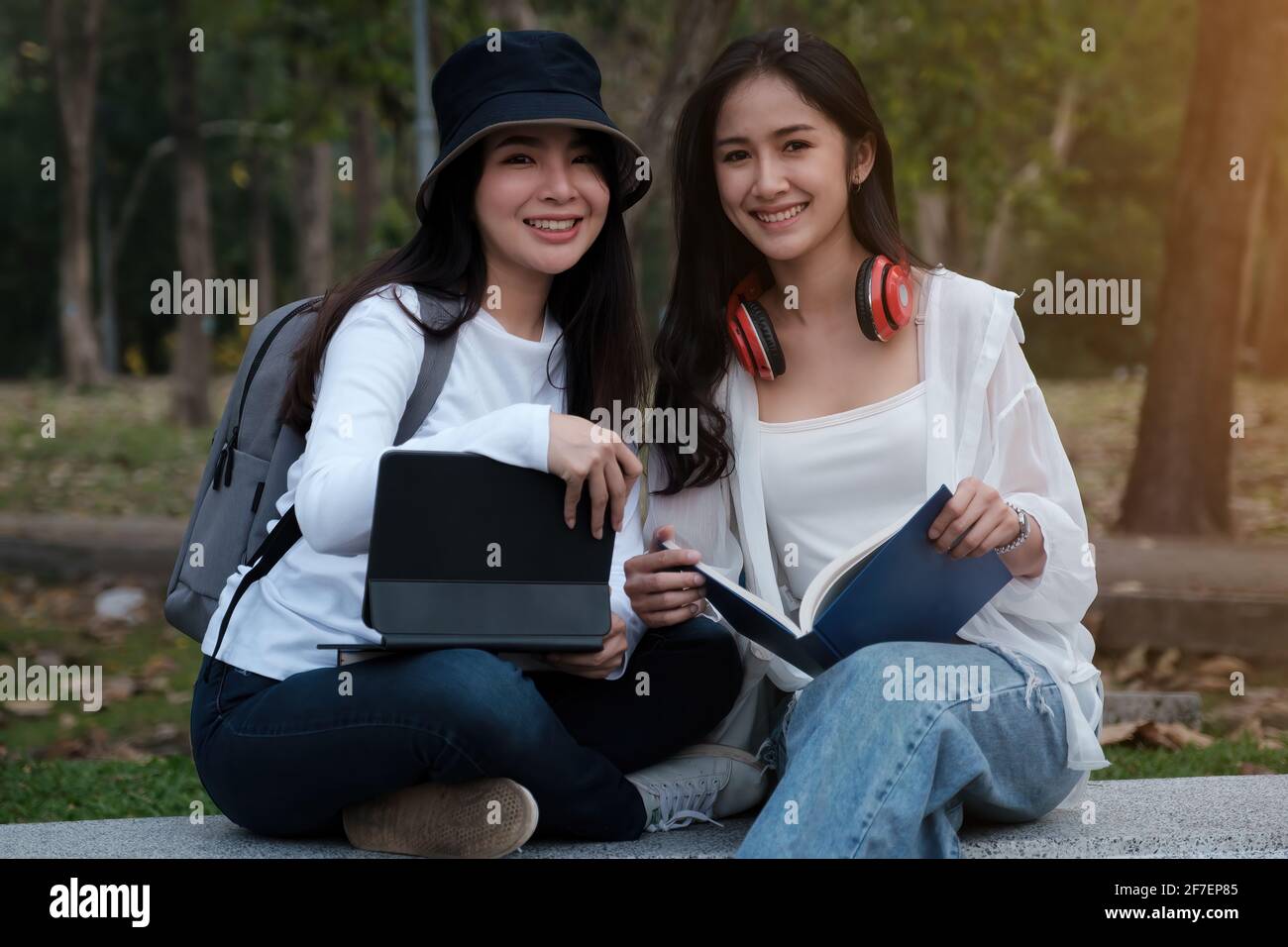 Friends or Family concept. Two Female using maps on tablet while travel. Stock Photo