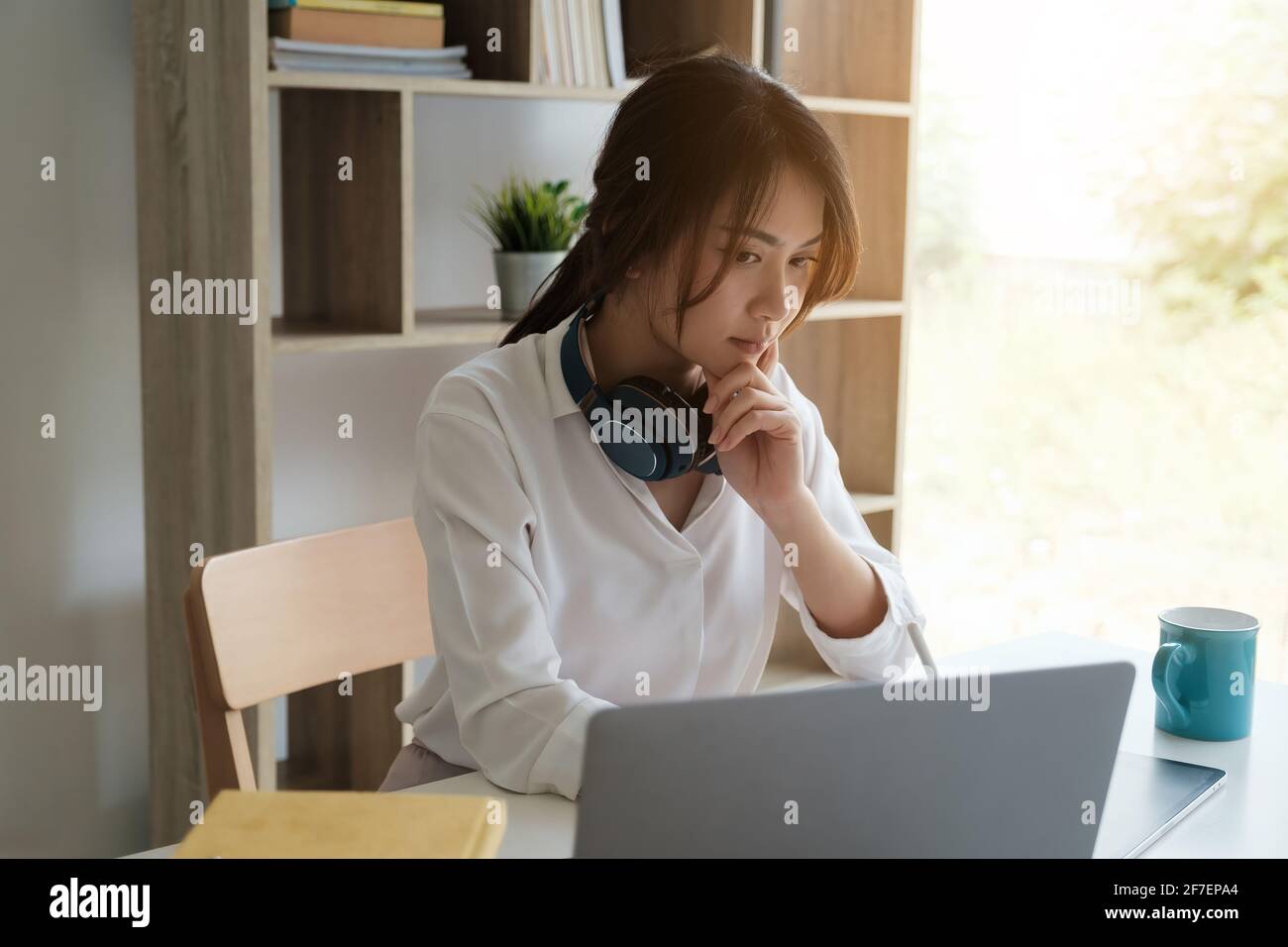 User experience concept. Creative Web Designer sketching application and developing template layout on laptop, framework for digital devices. Stock Photo
