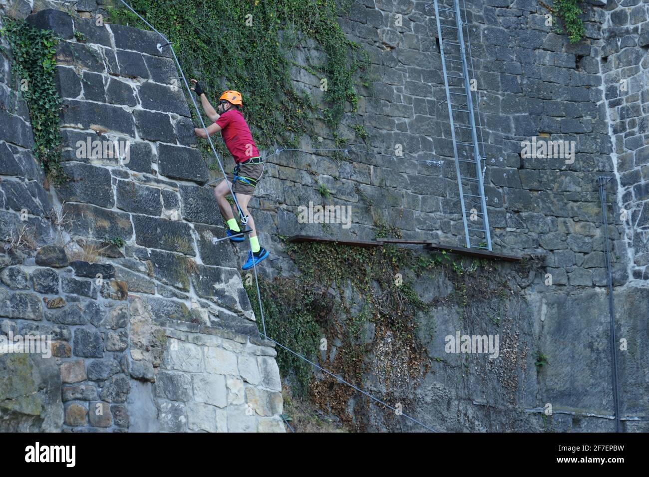 Decin, Czech Republic May 7 2020 Man climbing stone wall on via