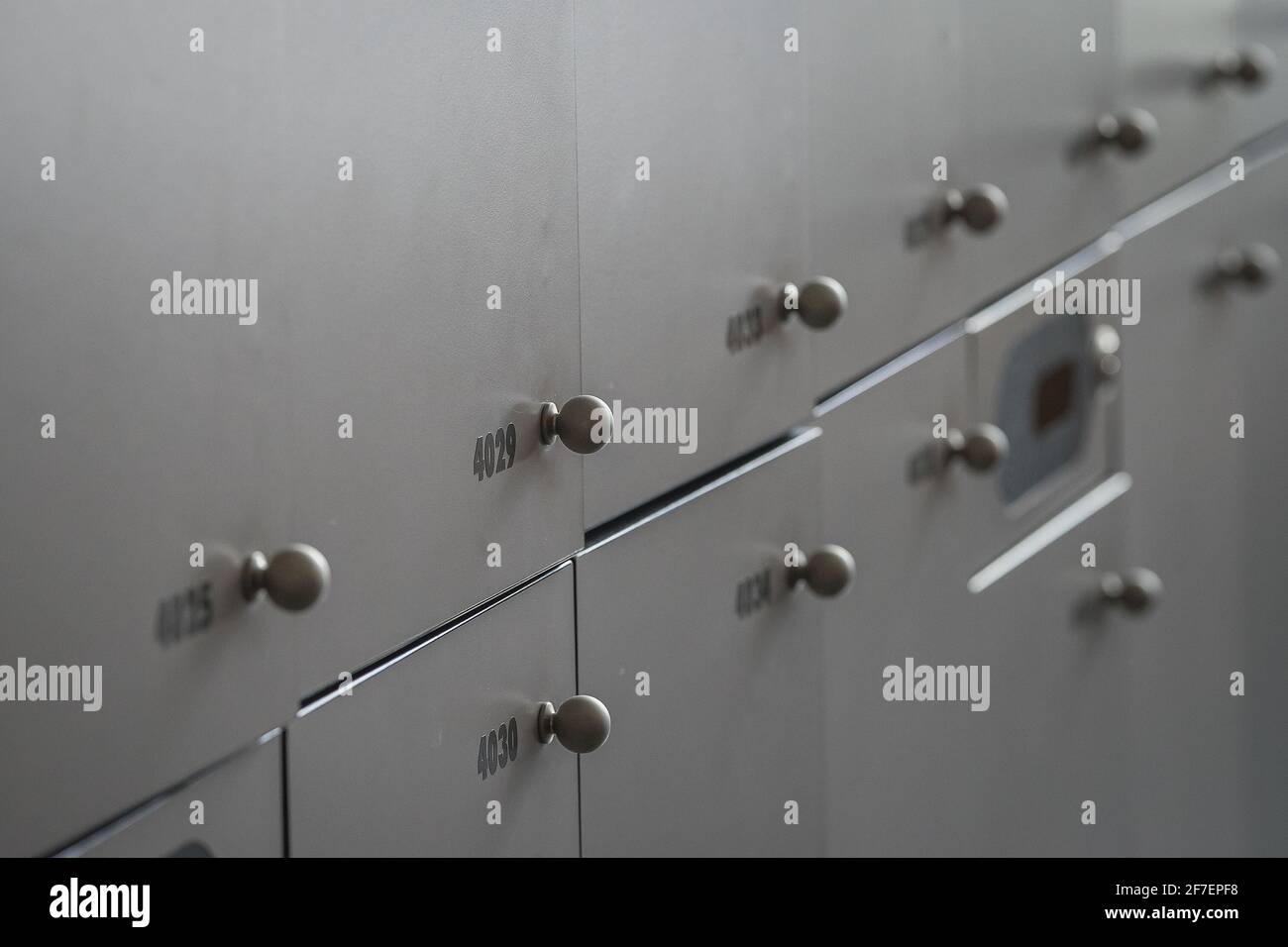 Close up of many lockers or metal or wooden lock boxes. Lockers with