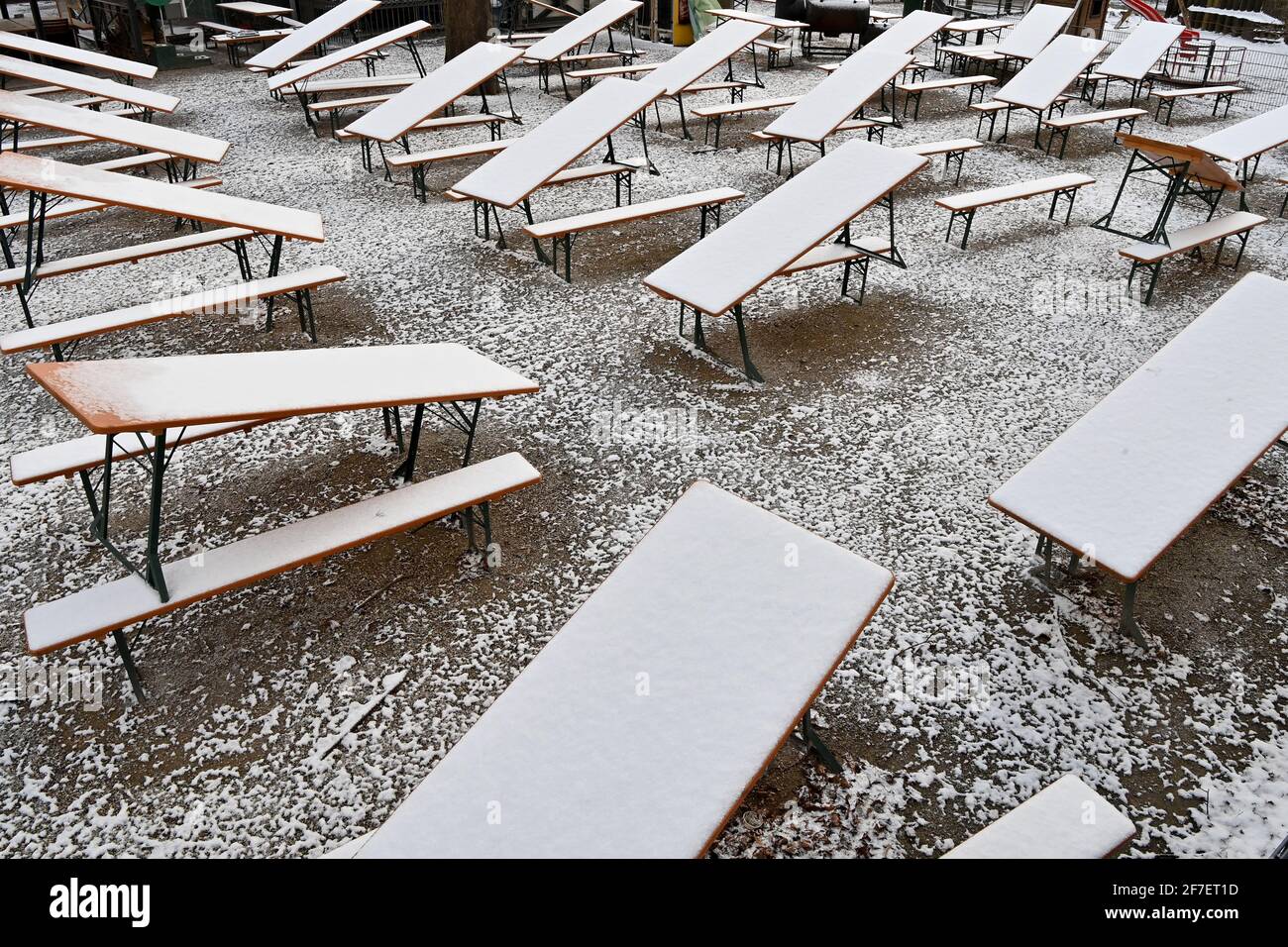 Munich, Germany. 07th Apr, 2021. Assembled beer tables and benches stand in the Seehaus beer garden at Kleinhesseloher See in the English Garden. Credit: Peter Kneffel/dpa/Alamy Live News Stock Photo