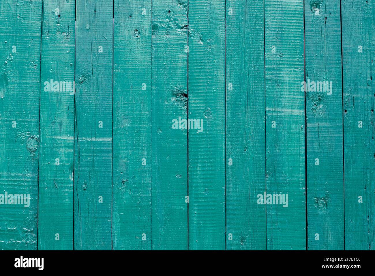 Old wooden turquoise fence, plank pattern, wood floor texture, vintage door, painted timber wall, striped surface, green stained furniture, weathered Stock Photo