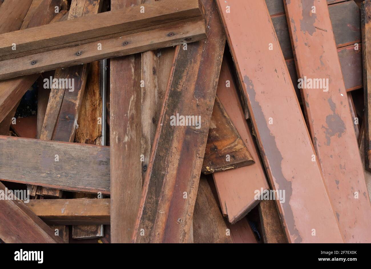 Closeup pile of damaged plank wood dumped on the floor during repairing work, high angle view Stock Photo