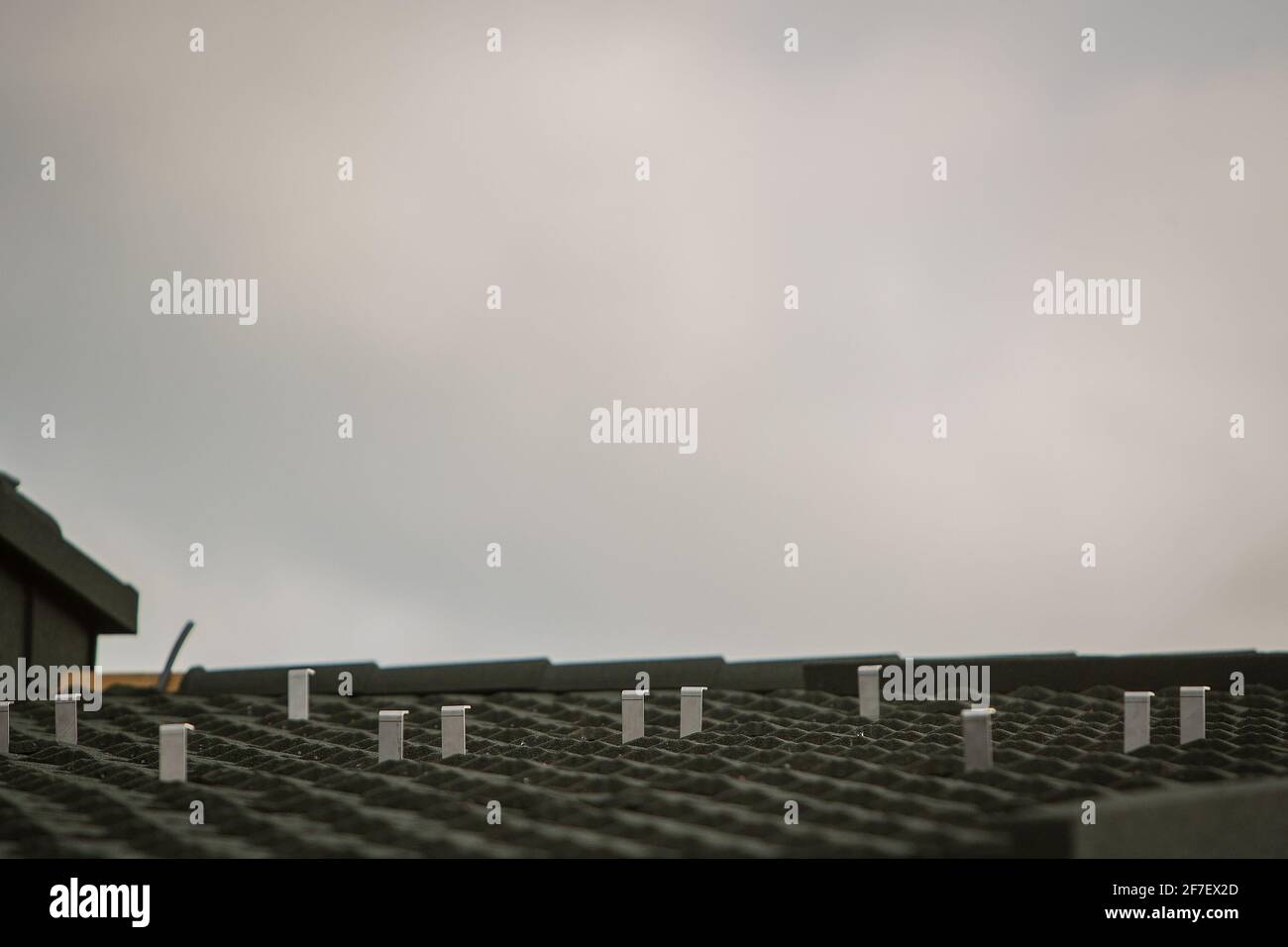 Detail of a domestic electric power plant holders or hangers, fixation points for solar panels. Stock Photo