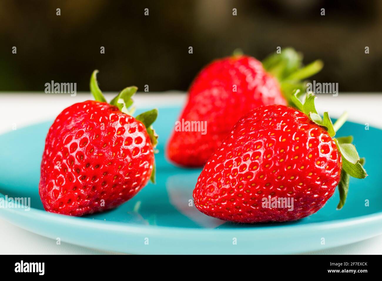 Strawberry on the blue background, raw real strawberry, ready to eat ...