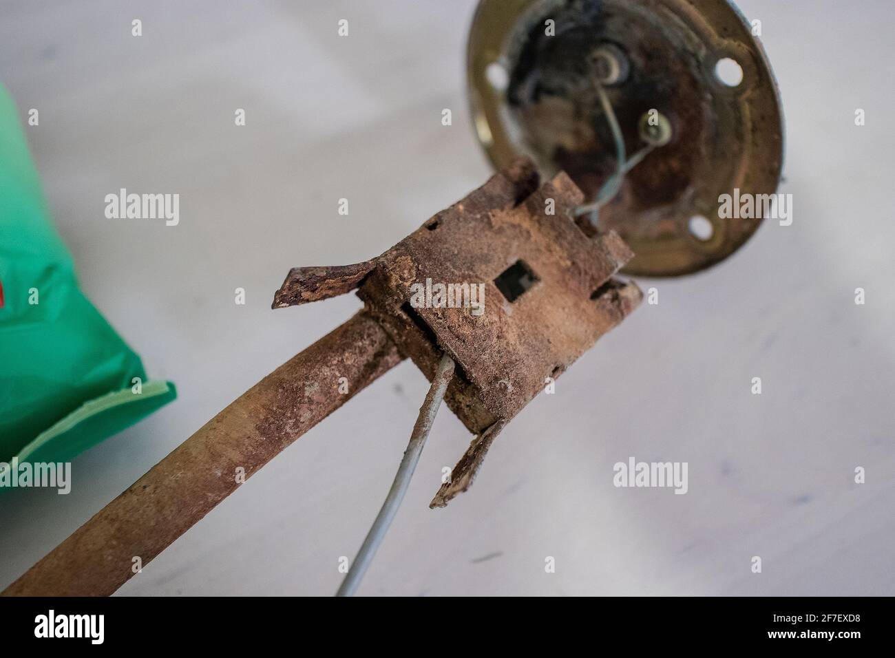 Rusted fuel sending gauge float of a car. Automotive fuel float under