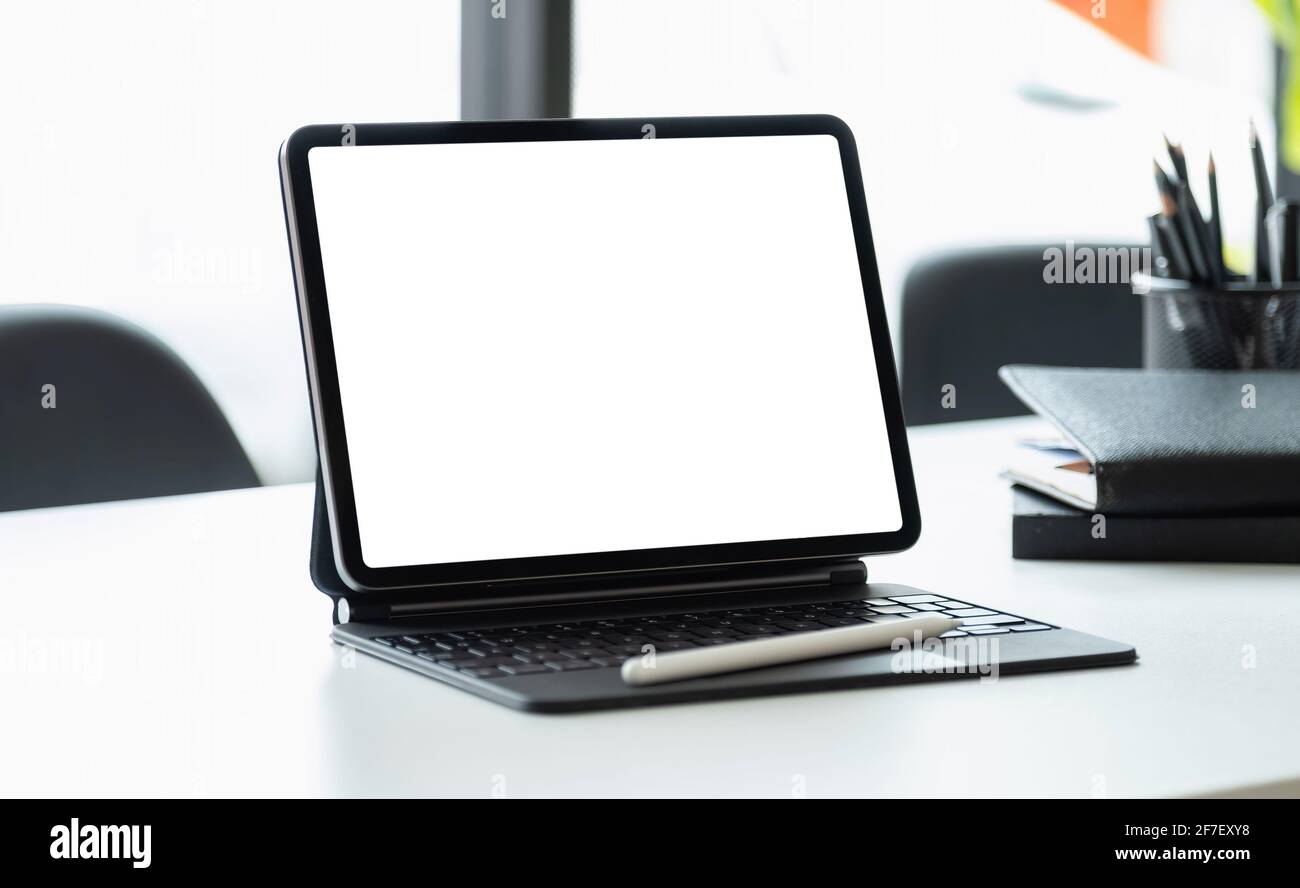 Digital tablet with blank screen on workplace desk Stock Photo - Alamy