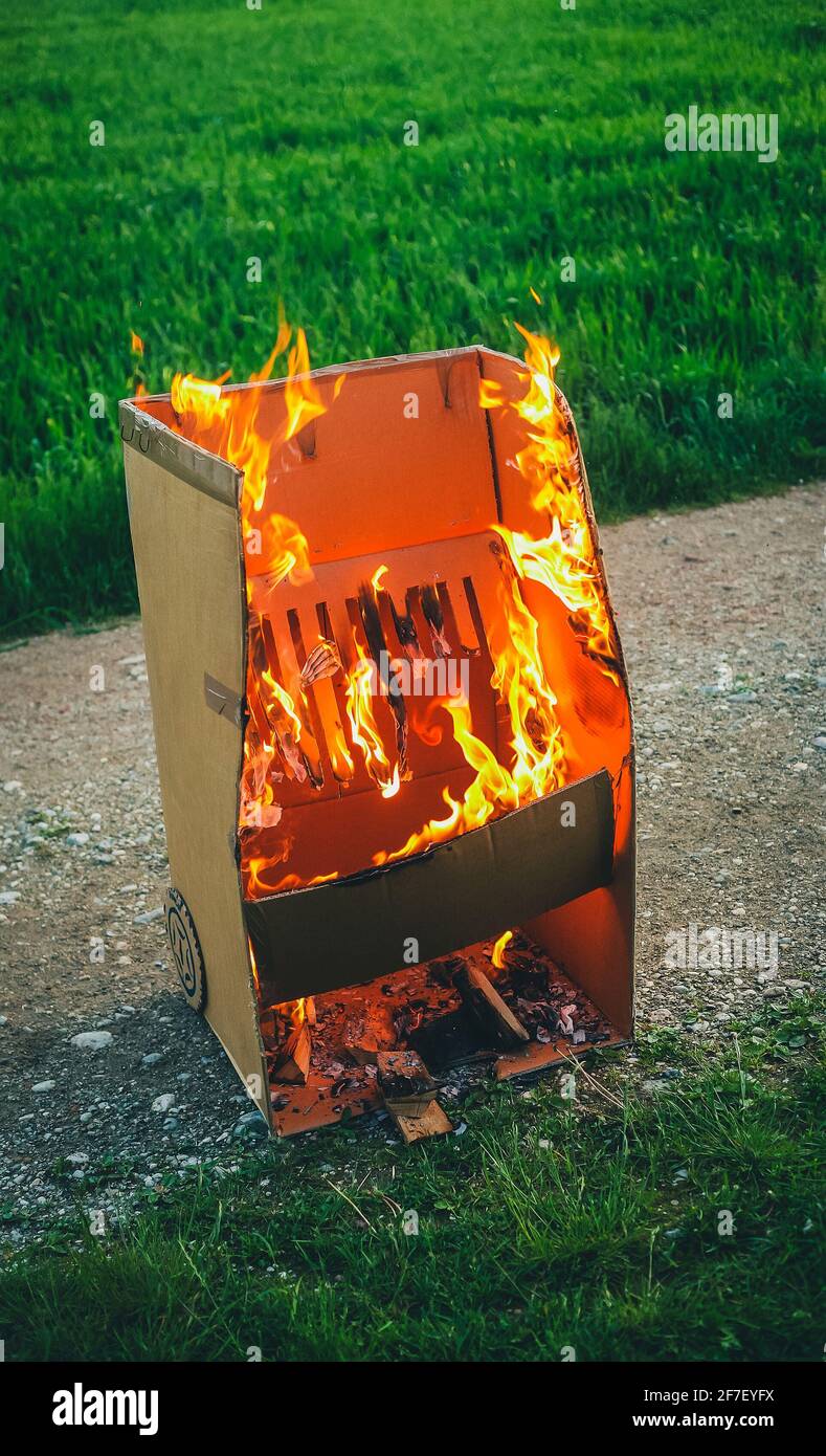 Fake cardboard grill is burning hard. Cardboard grill made out of fun