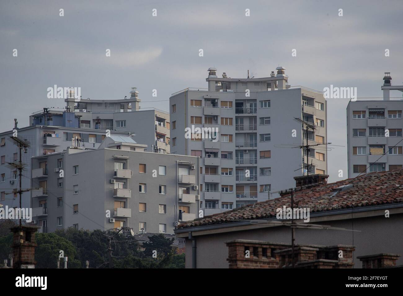 City blocks or condominiums packed together in a city of Rijeka, Croatia on a sunny autumn day. Socialistic cubical buildings. Stock Photo