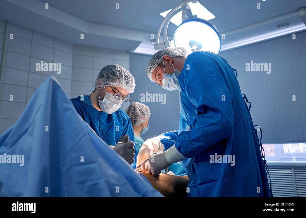 doctors work hard in the operating room Stock Photo