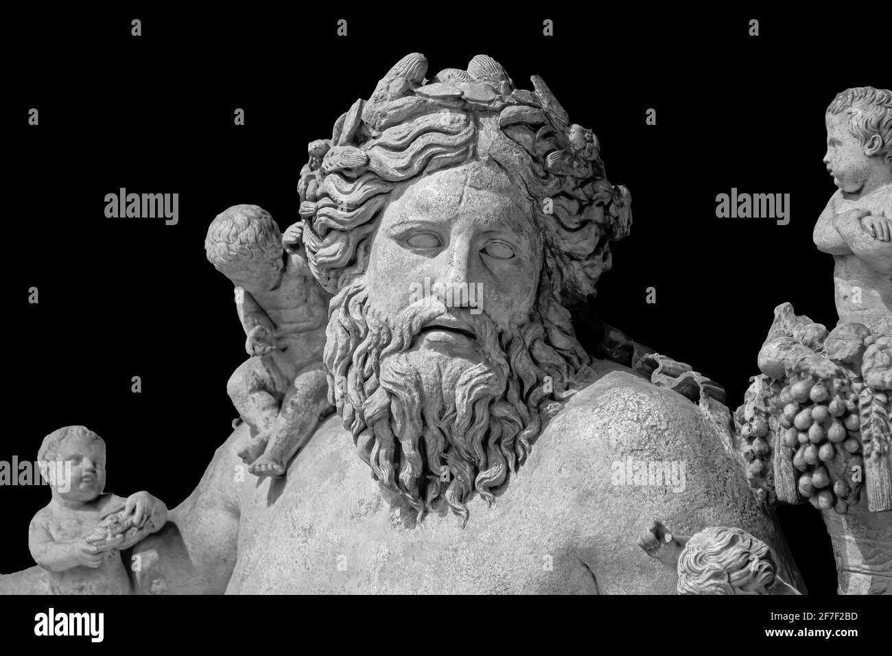 Ancient statue of Nile river god. Head and shoulders detail of the ancient art sculpture bearded man isolated on background Stock Photo
