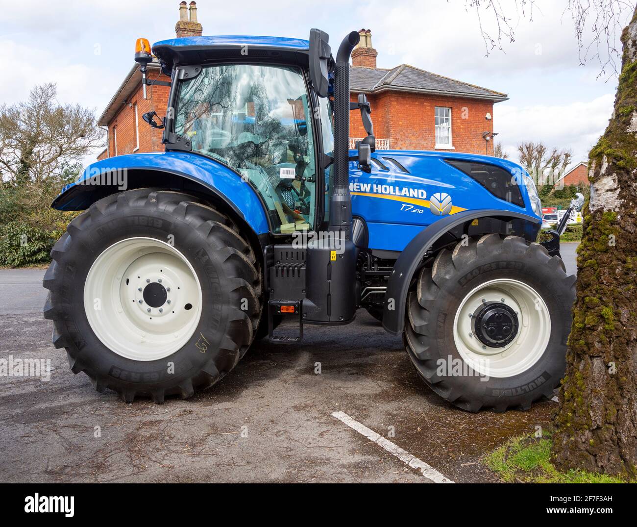 Brand new New Holland tractor T7210 for sale on dealership forecourt, Wiltshire, England, UK