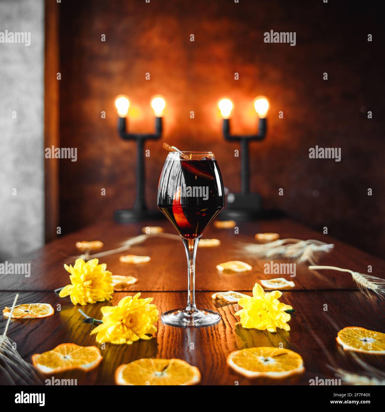 Elegant red wine cocktail on decorated background Stock Photo