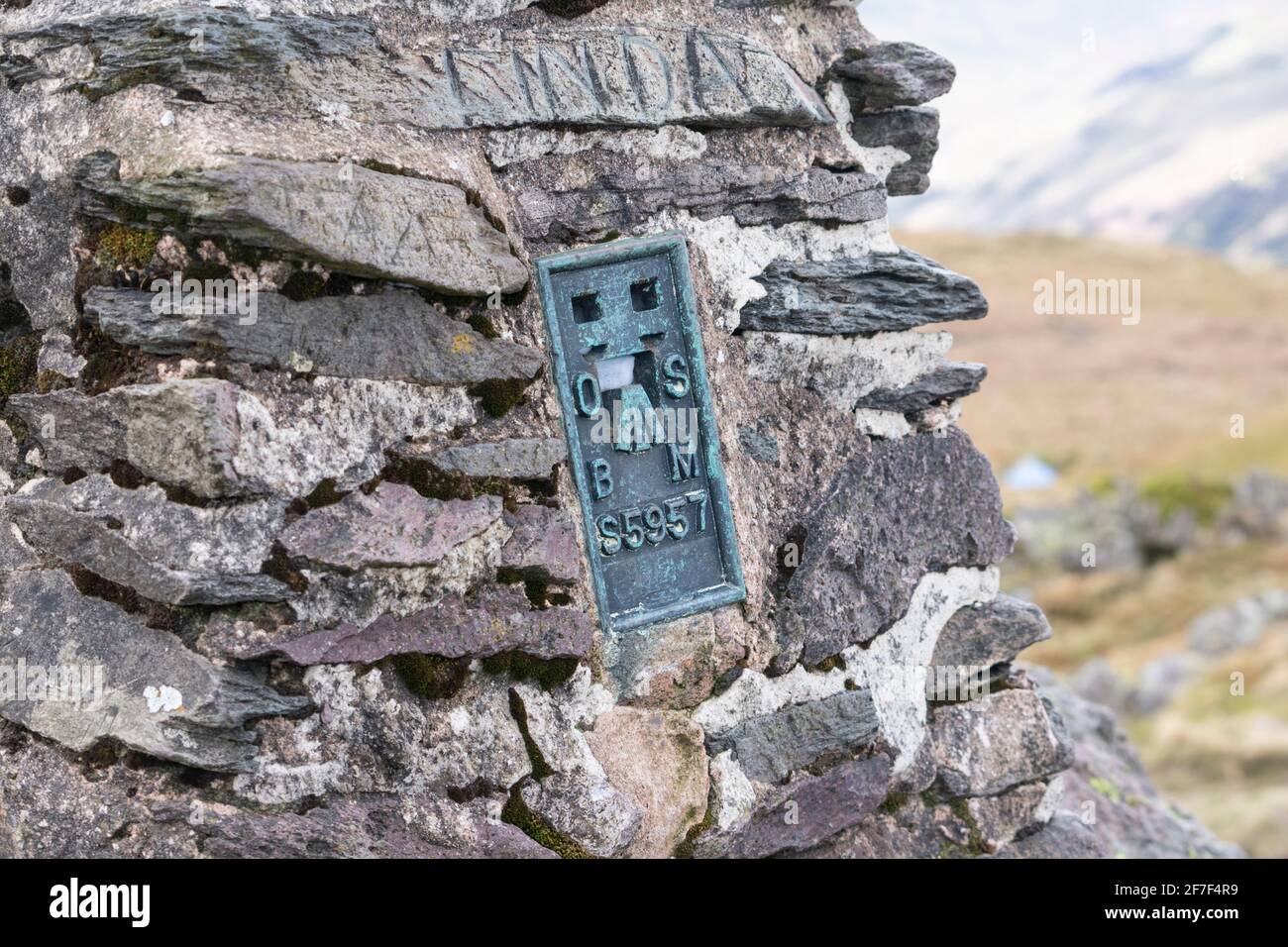 Close up of Trig point plaque on Place Fell summit, near Ullswater, Lake District Stock Photo