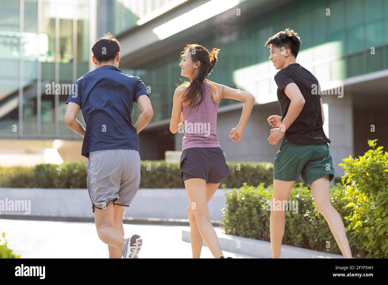Young friends running outdoors hi-res stock photography and images - Alamy