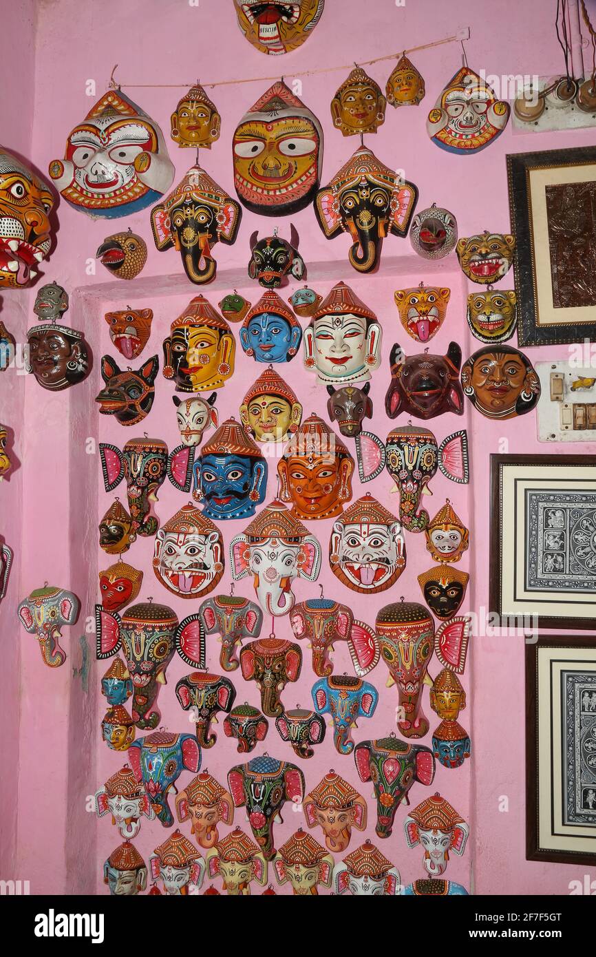 Paper Mache colorfully masks on display in a gift shop of Raghurajpur