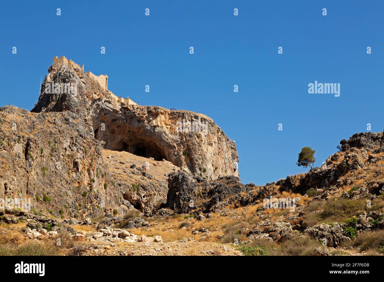 The Lindian Acropolis, an Ancient Greek citadel, on a rocky outcrop in Lindos on Rhodes, Greece. The citadel was later a base for the Knights of St Jo Stock Photo