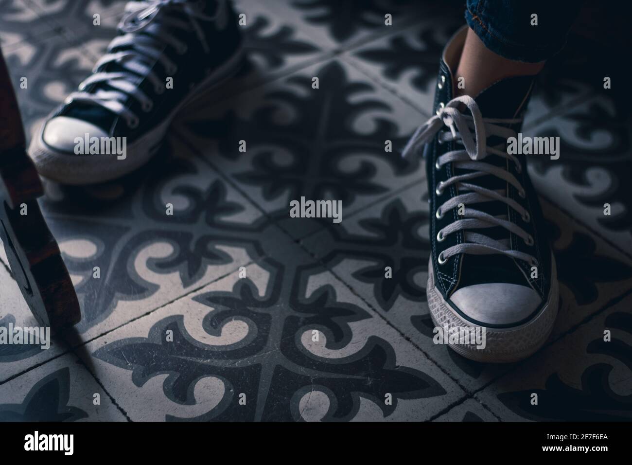 A pair of shoes on a floor tiles Stock Photo Alamy