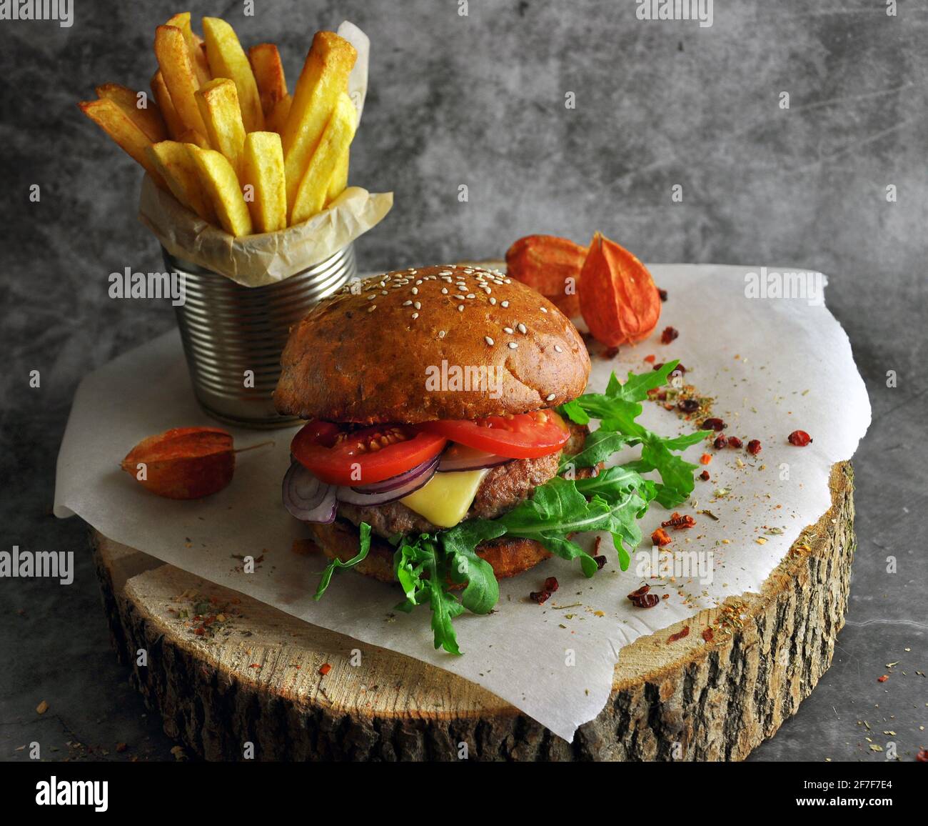 Burger on a wooden board. Restaurant serving concept. Stock Photo