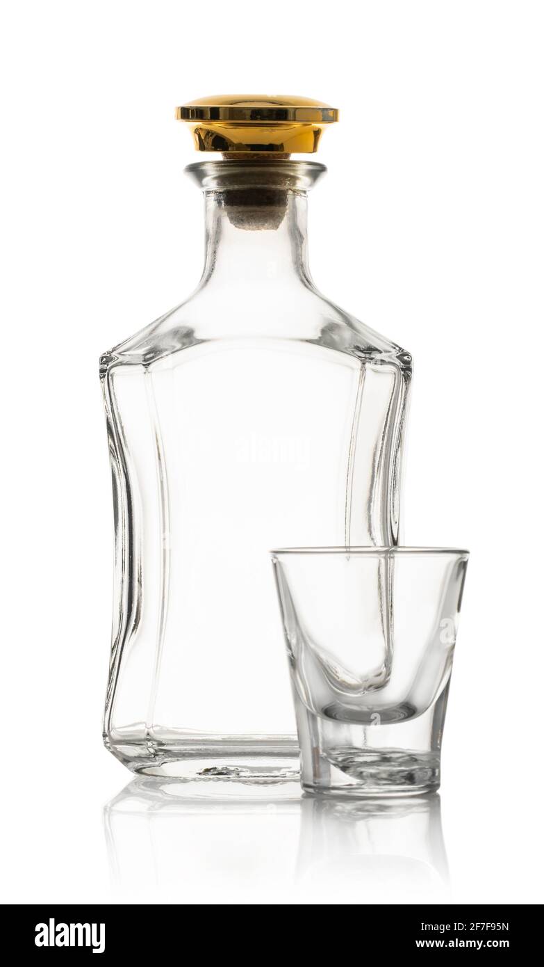 empty whiskey bottle and glass on white isolated background Stock Photo