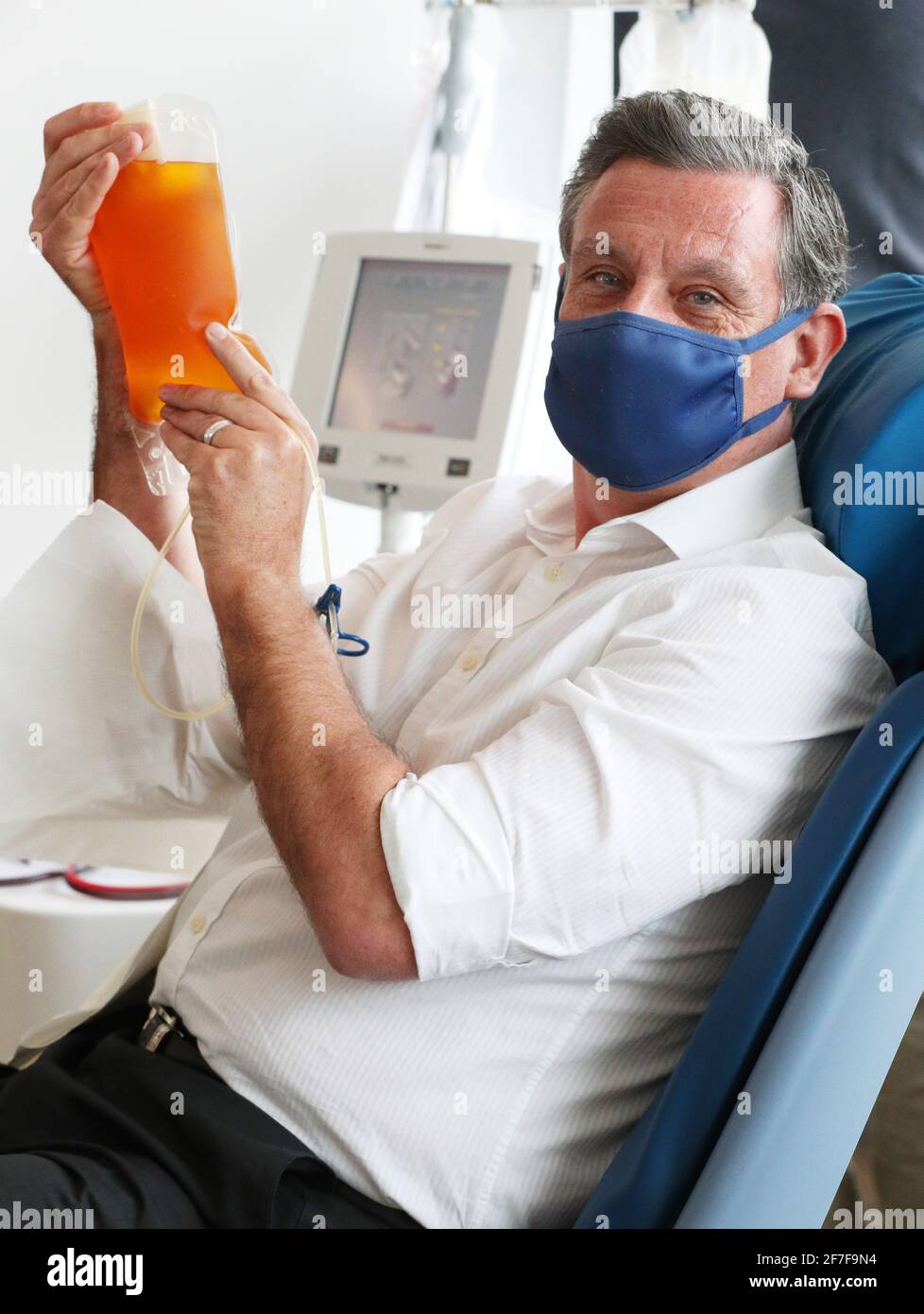 Plasma donor Martin Rengger, 51, of Weybridge, Surrey with his bag of plasma, the first collected in more than 20 years at the Twickenham Donor Centre, south-west London, after a ban on the procedure was lifted in February. The ban was originally imposed in 1998 amid concerns about the spread of a human variant of BSE Ð dubbed 'mad cow disease' Ð known as Creutzfeldt Jakob Disease. Picture date: Wednesday April 7, 2021. Stock Photo