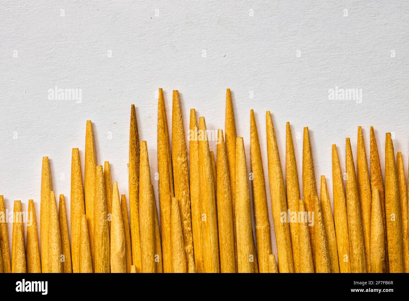 Macro of wooden toothpicks isolated on white background Stock Photo - Alamy
