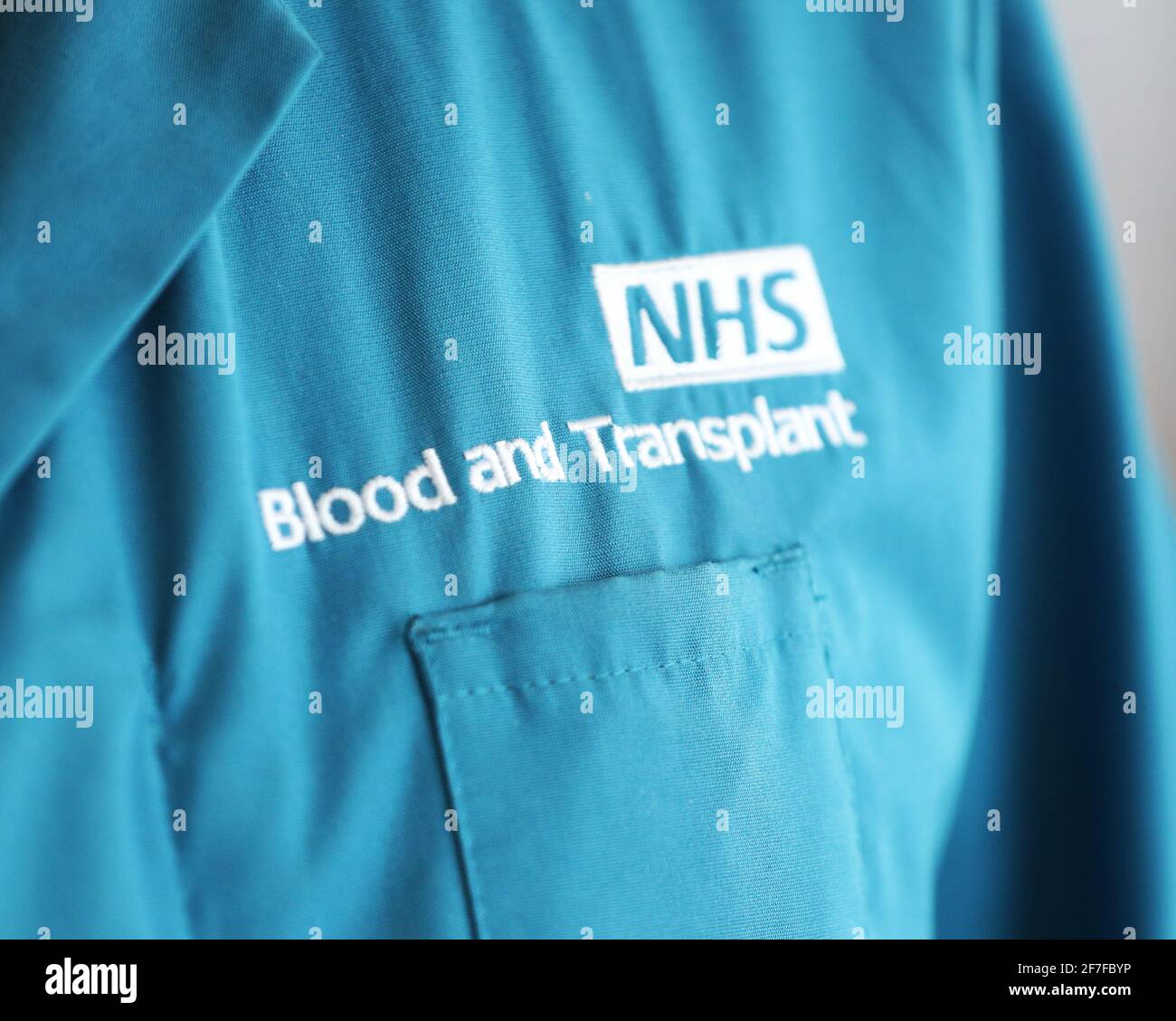 A donor carer's branded uniform at the Twickenham Donor Centre, south-west London, after a ban on the procedure was lifted in February. The ban was originally imposed in 1998 amid concerns about the spread of a human variant of BSE – dubbed 'mad cow disease' – known as Creutzfeldt Jakob Disease. Picture date: Wednesday April 7, 2021. Stock Photo