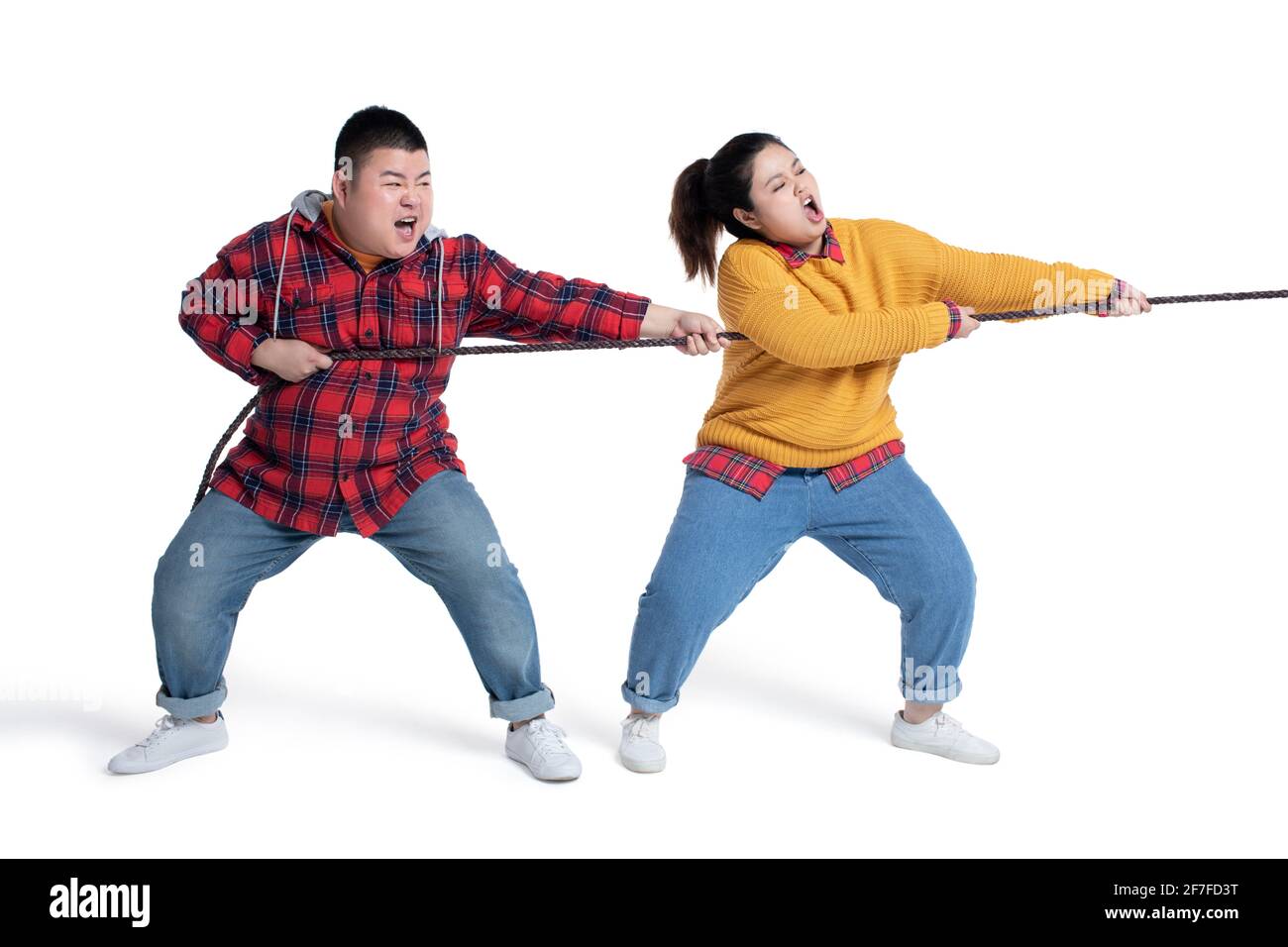 Young couple pulling rope Stock Photo Alamy