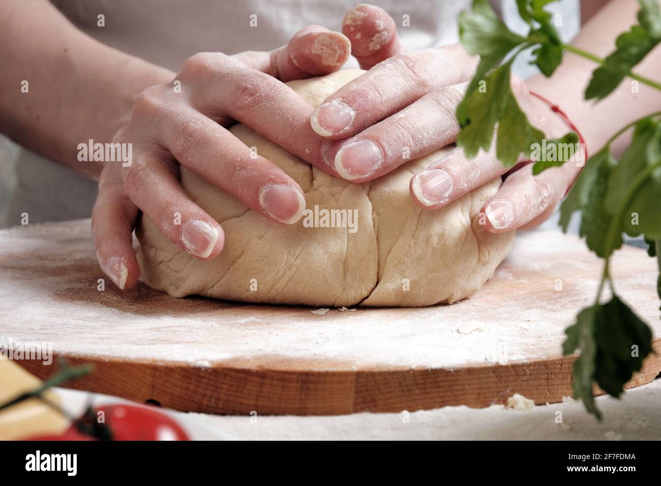Women's hands knead the dough from wheat flour Stock Photo Alamy