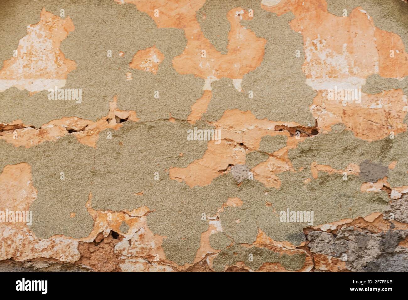 Old plastered wall with cracked paint. Background, texture. Stock Photo