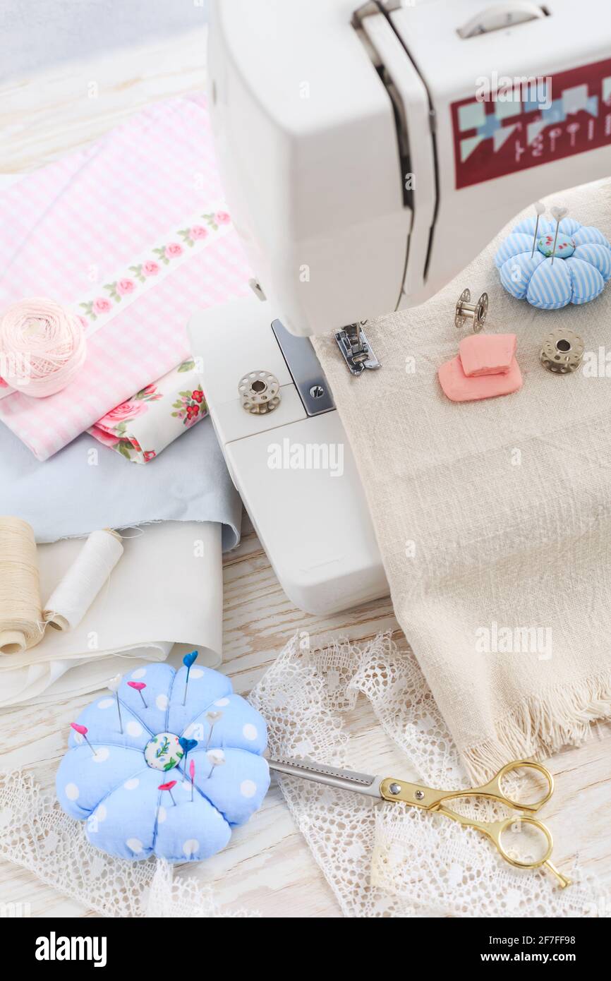 Sewing machine, tools and supplies. Hobby, crafting, creativity, free time at home concept. Stock Photo