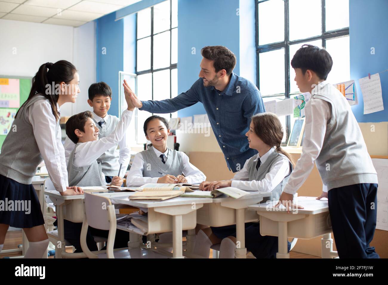 Students and teacher celebrating Stock Photo - Alamy