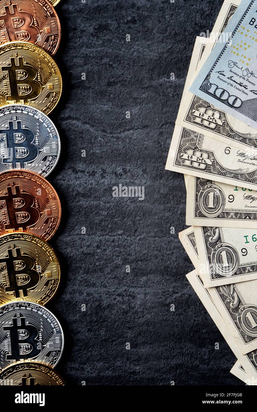 Business top view design concept of cryptocurrency bitcoin with USD Dollar  paper currency money over dark black table background Stock Photo - Alamy