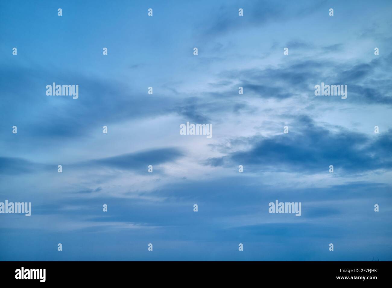 dramatic cloudy sunset sky blue hour background Stock Photo - Alamy