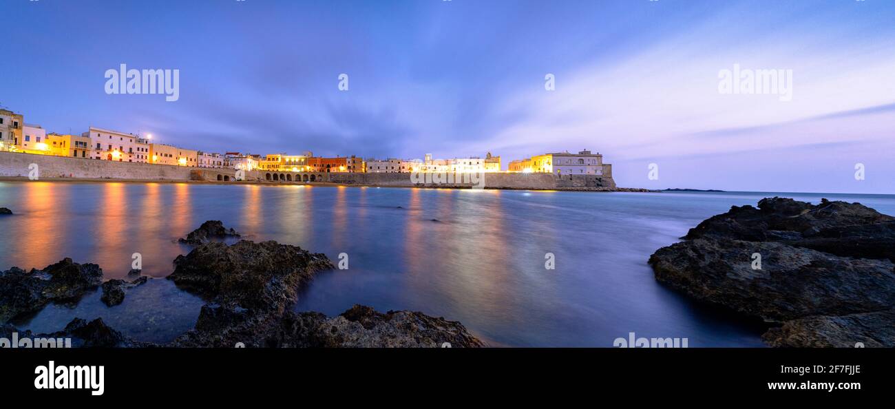 Clouds over Gallipoli washed by the Ionic Sea at dusk, Lecce province, Salento, Apulia, Italy, Europe Stock Photo