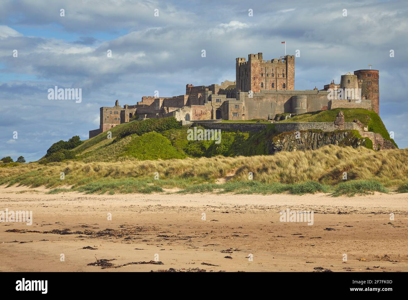 Bamburgh Castle and its beach, at Bamburgh, near Seahouses ...