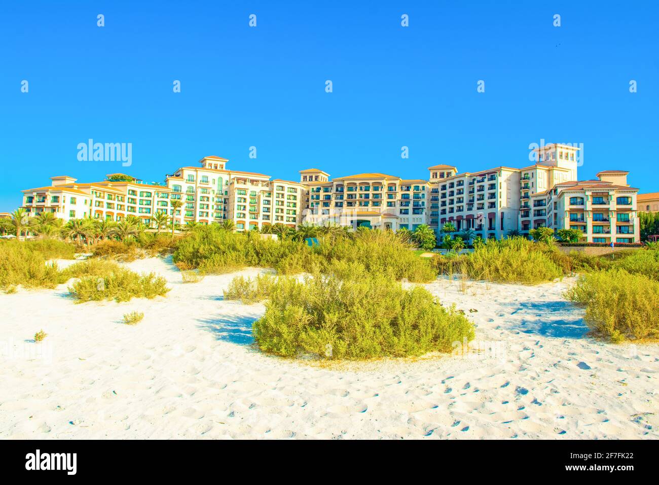 Adu Dhabi, UAE - 27 March 2018: View from the sandy beach to the main building of the luxury hotel - St. Regis Saadiyat Island Resort Stock Photo