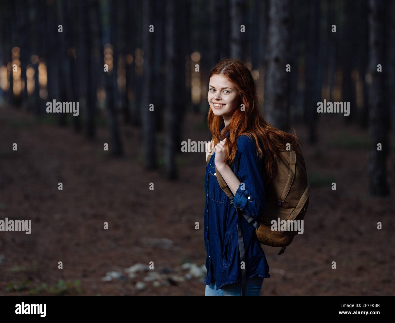 Woman in yellow backpack walks hi-res stock photography and images - Alamy