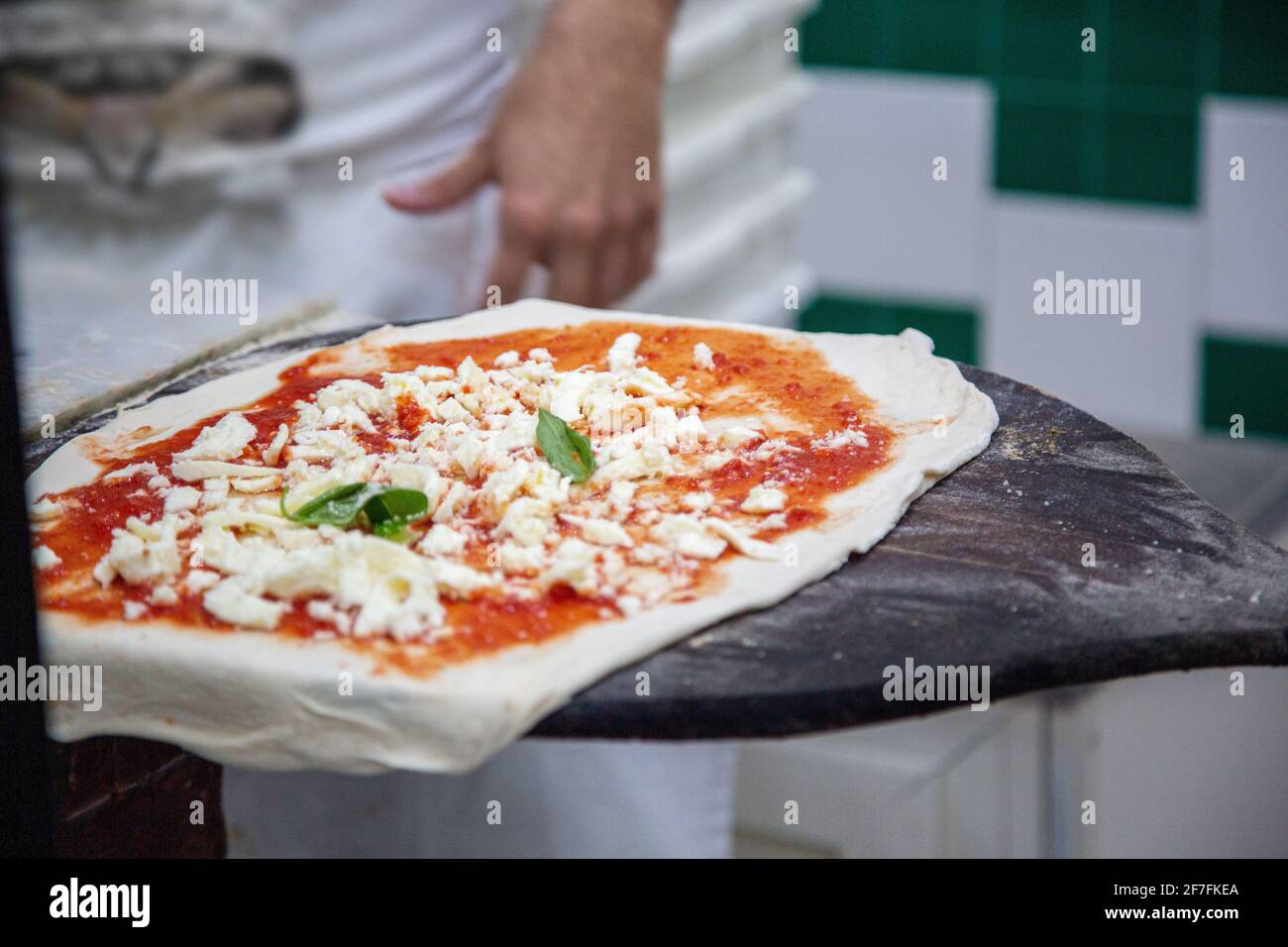 Cooking pizza Margherita in Pizzeria da Michelle in Naples, Italy Stock Photo