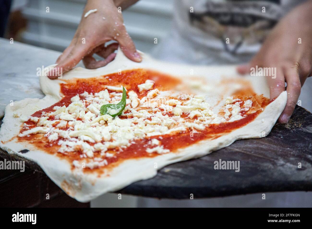 Cooking pizza Margherita in Pizzeria da Michelle in Naples, Italy Stock Photo