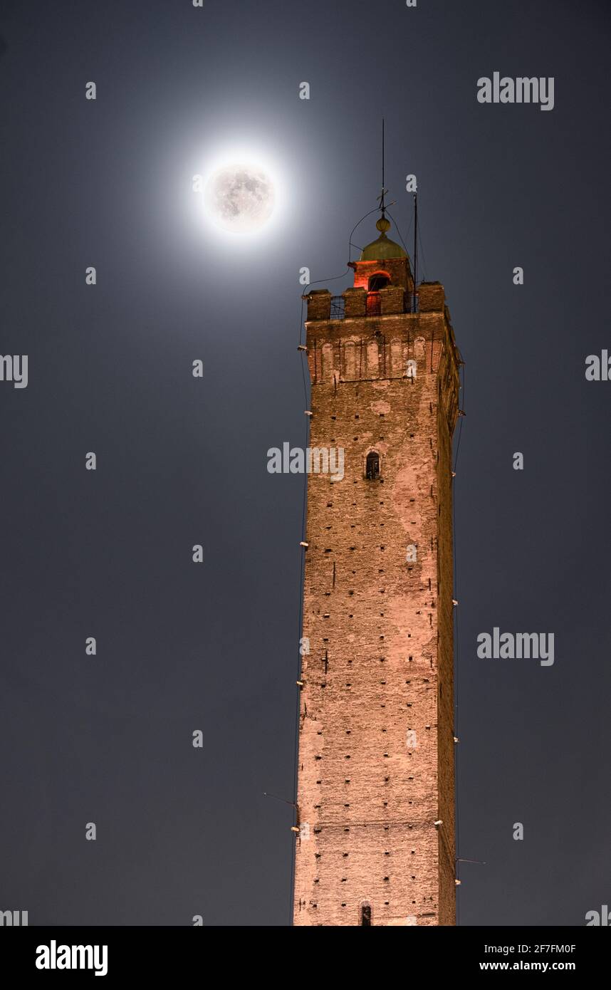 Full moon and Torre Asinelli, the highest tower of Bologna and symbol