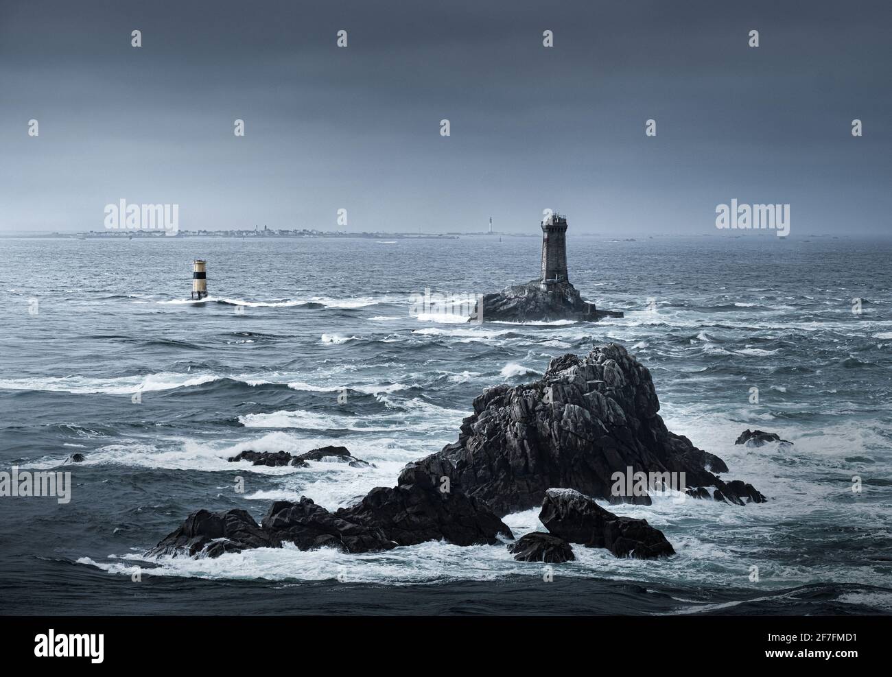 View of the ocean at Pointe du Raz with two lighthouses, Phare de la Vieille and Tourelle de la Plate (Petite Vieille), in the sea and rocks, France Stock Photo