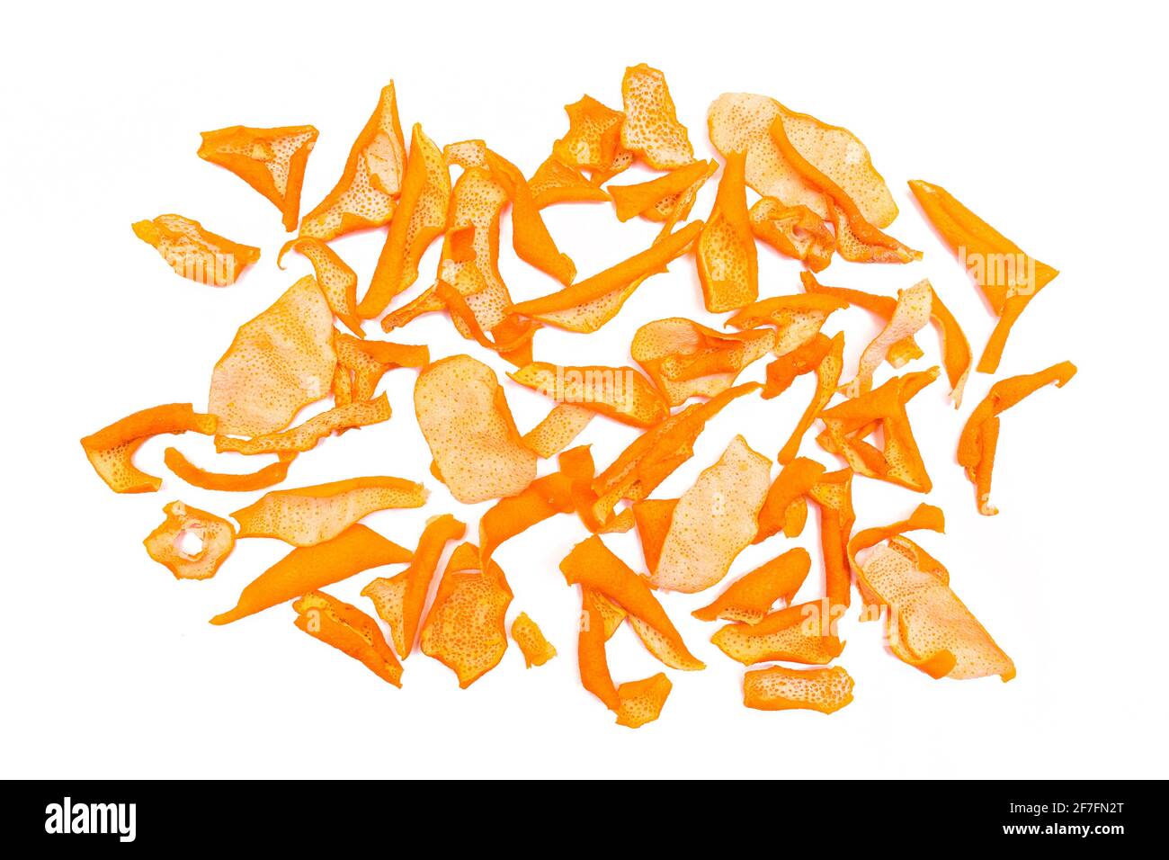 A pile of dried orange peels isolated on a white background Stock Photo