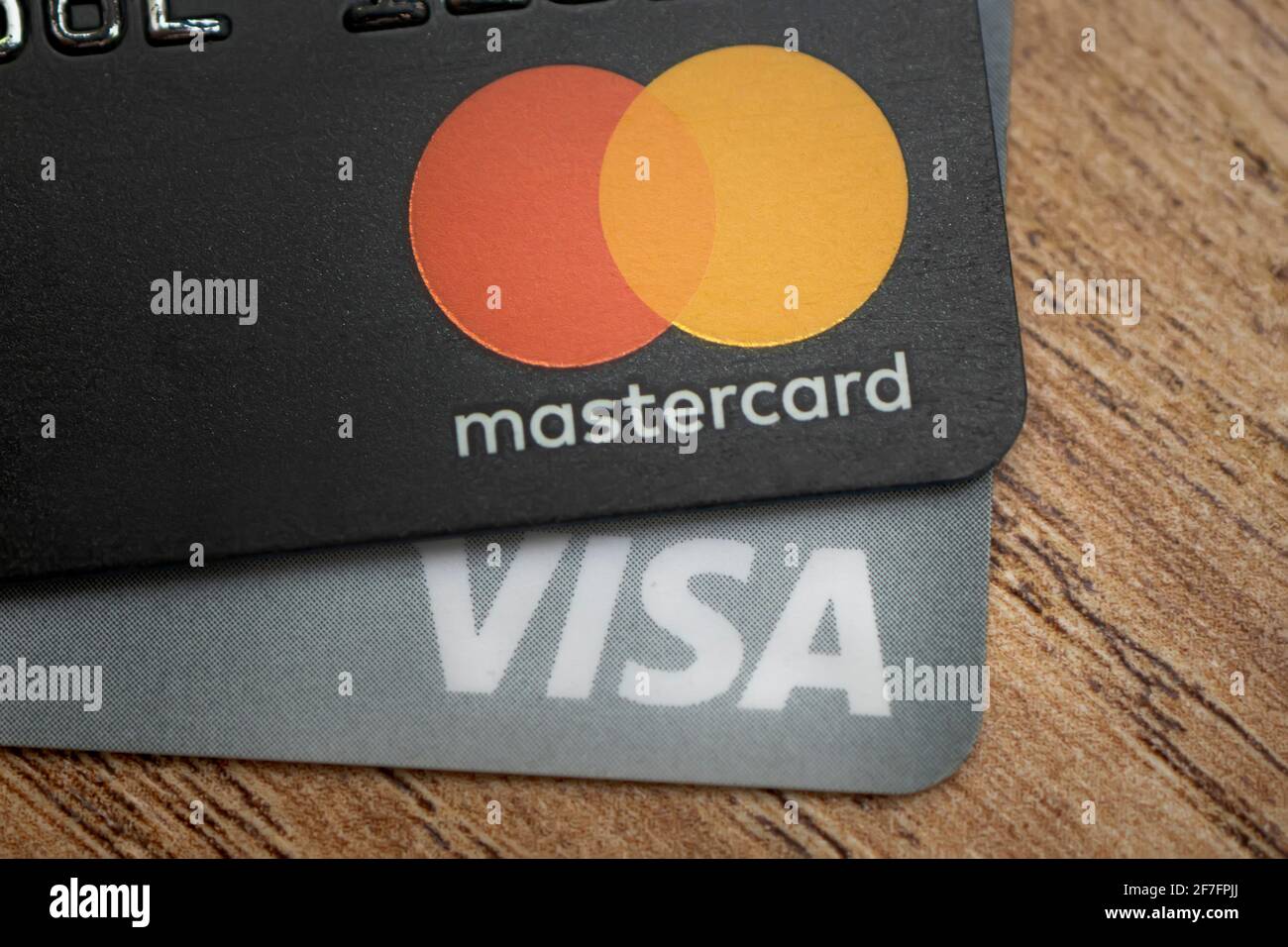 March 26, 2021. Close-up of a visa and mastercard cards on a wooden table Stock Photo