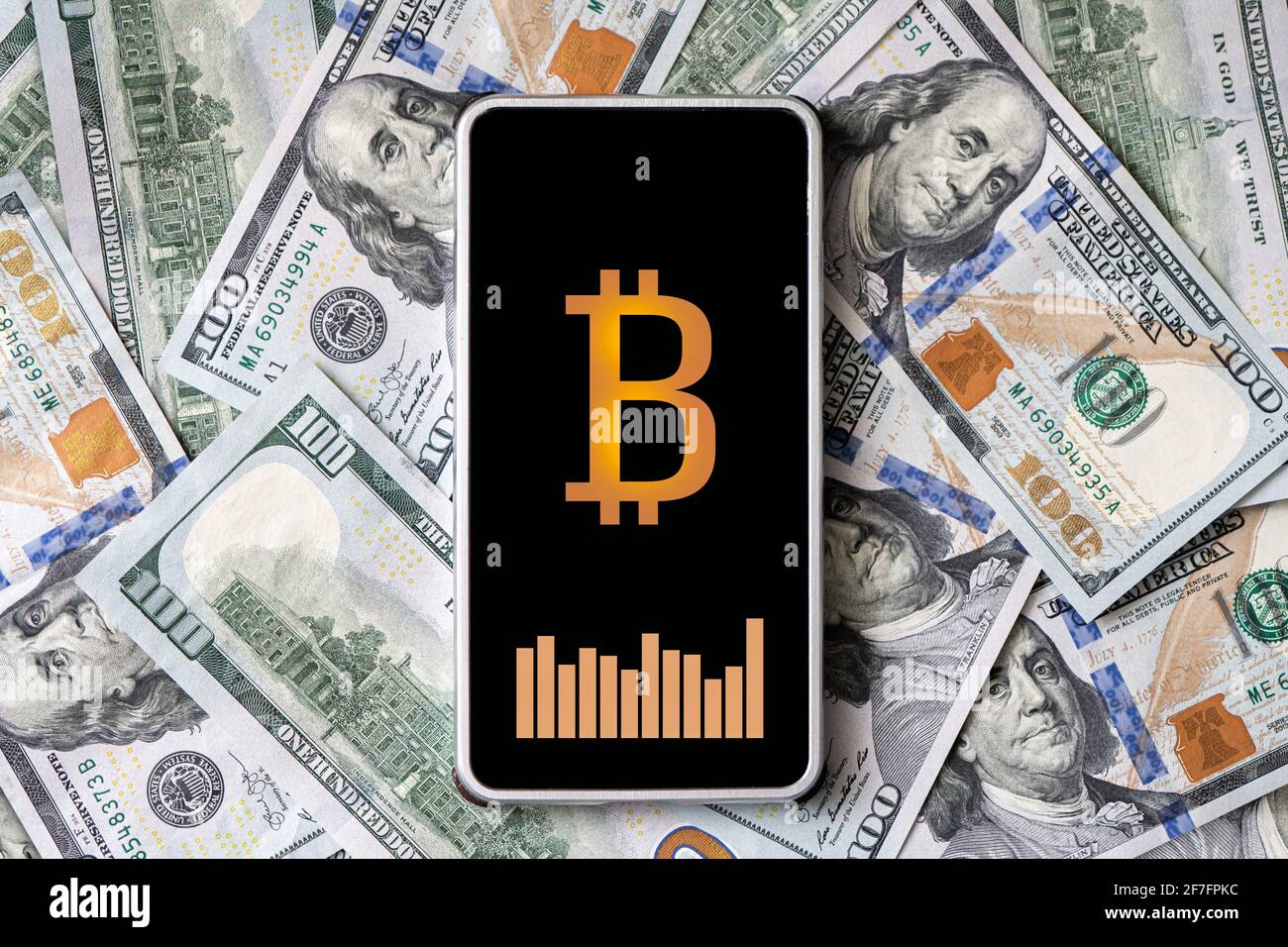 concept of earning money on cryptocurrency. A smartphone with a bitcoin  logo and a currency exchange rate chart on the smartphone screen against  the b Stock Photo - Alamy
