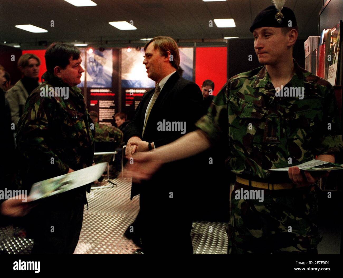 ANDREW SMITH MP VISITS THE ARMY RECRUITMENT STALL AT THE GRADUATE RECRUITMENT FAIR AT OLYMPIA, THE ARMY CURRENTLY HAS 15,000 VACANCIES TO FILL. Stock Photo