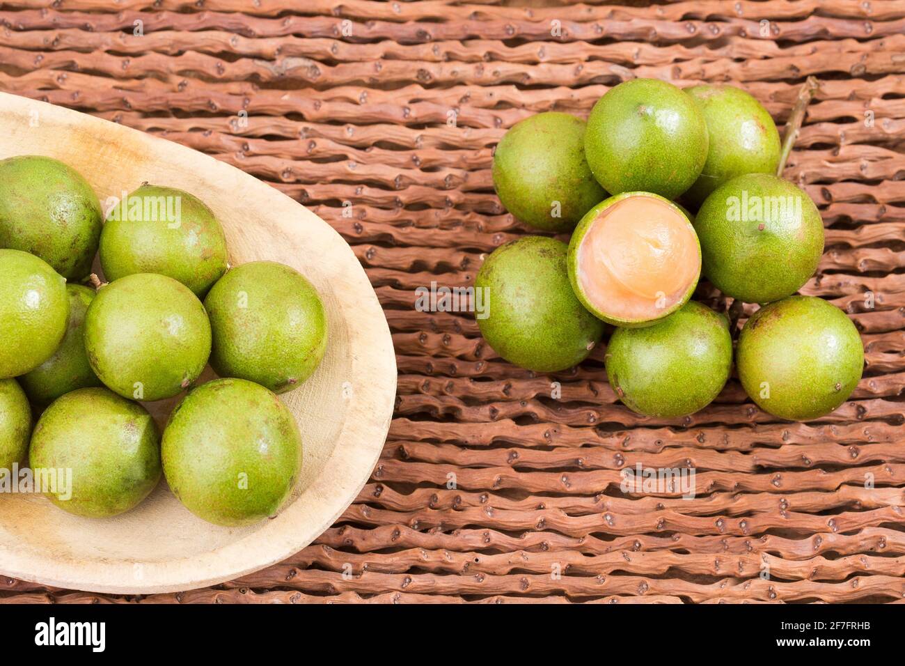 Fresh ripe peeled quenepa fruit Melicoccus bijugatus. Top view Stock