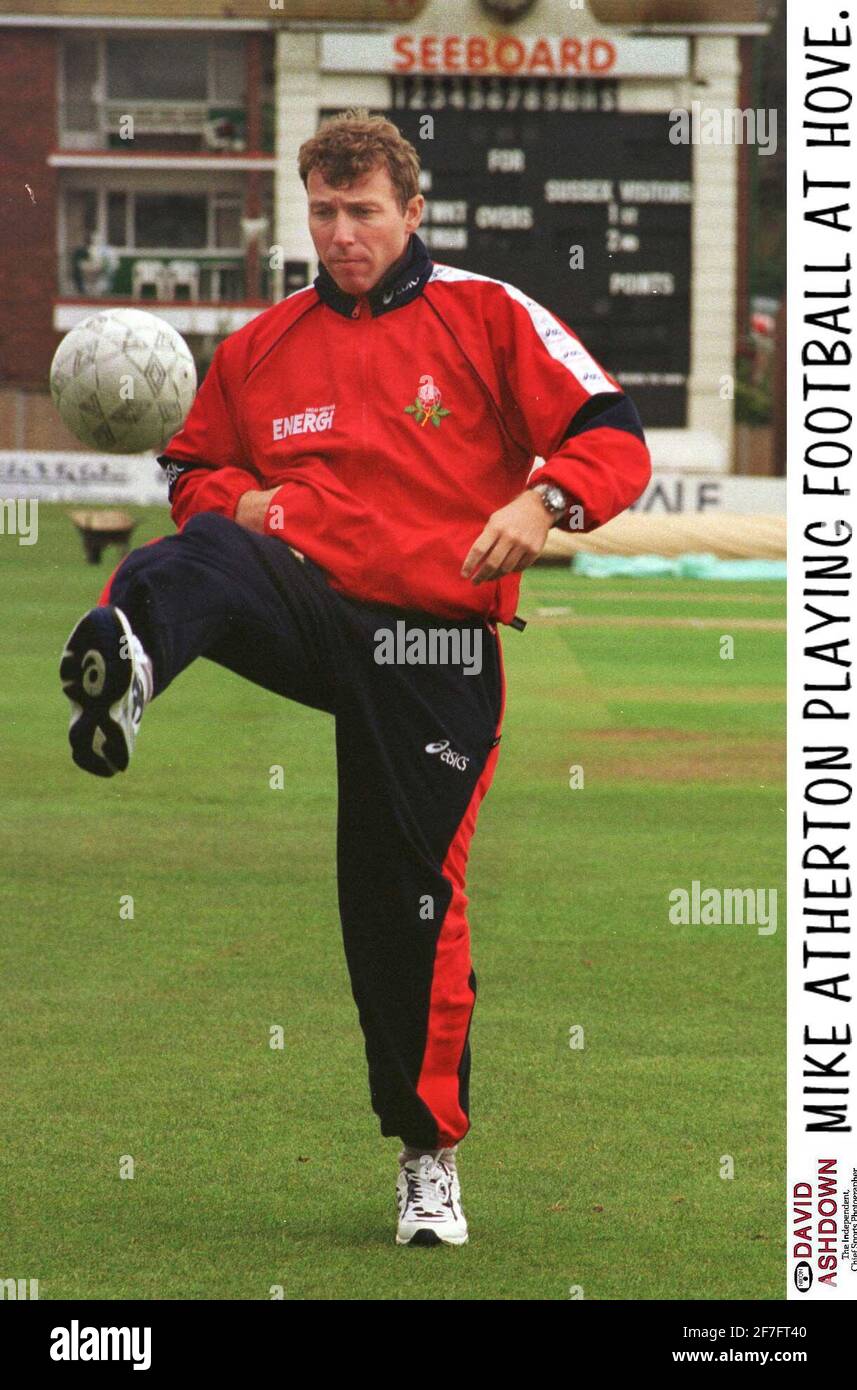 Mike Atherton Cricket Player playing football at home 1998 Stock Photo