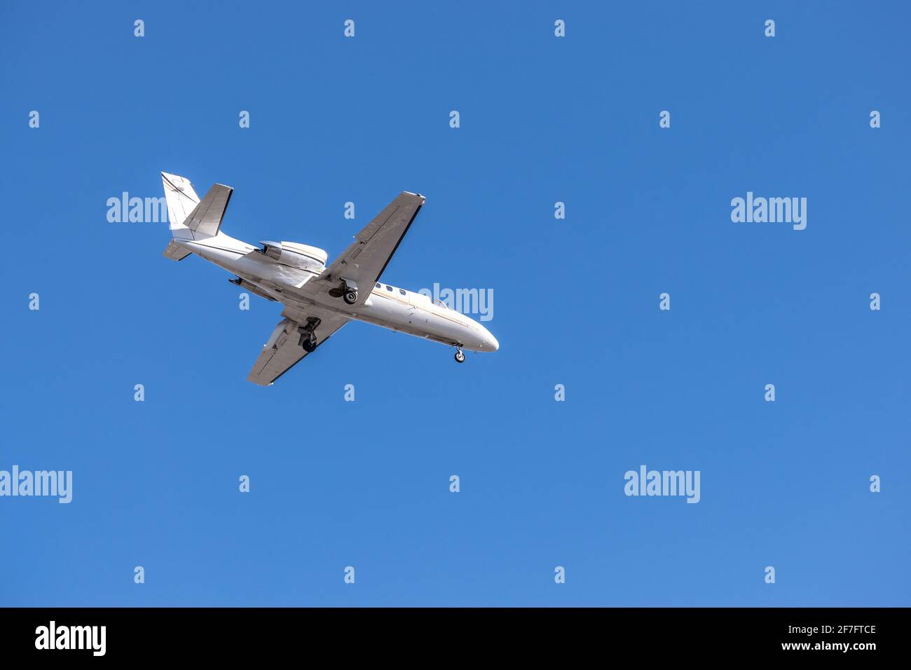 Business jet during landing Stock Photo