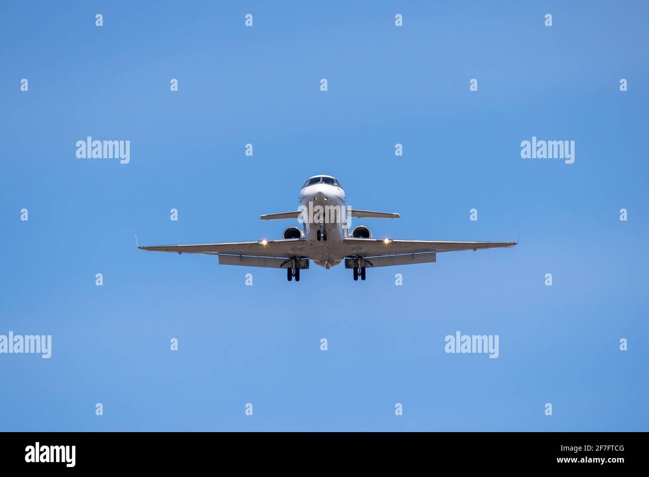 Business jet landing front view Stock Photo